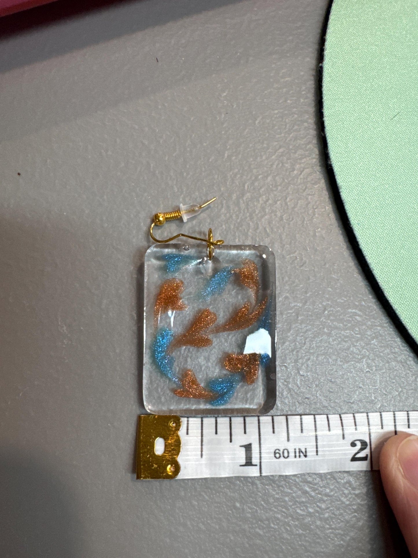 Brown and Blue swirling hearts in Clear Resin Earrings